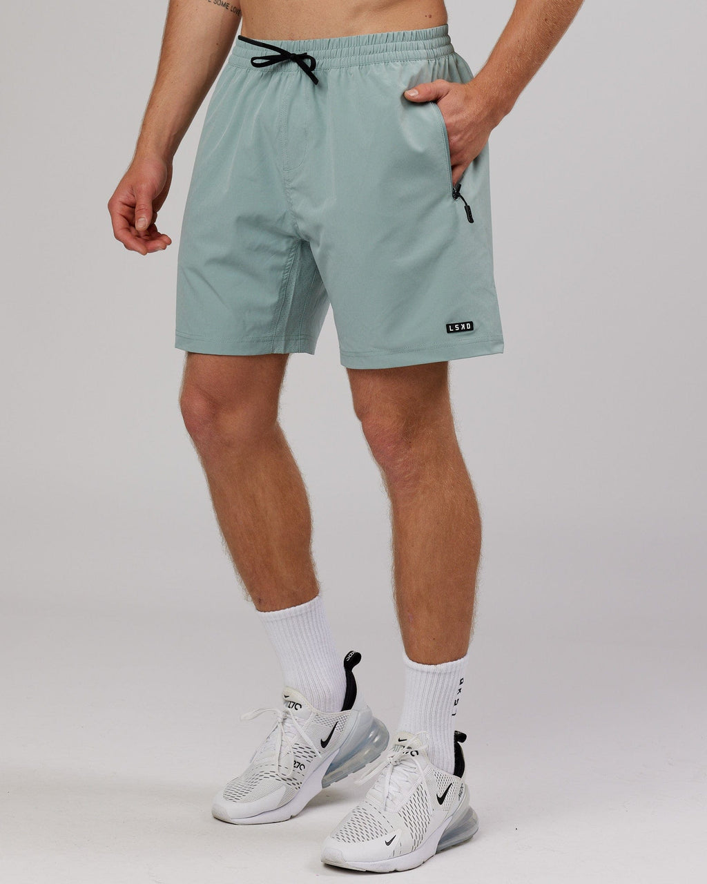Model wearing Rep 7'' Performance Short - Frost
