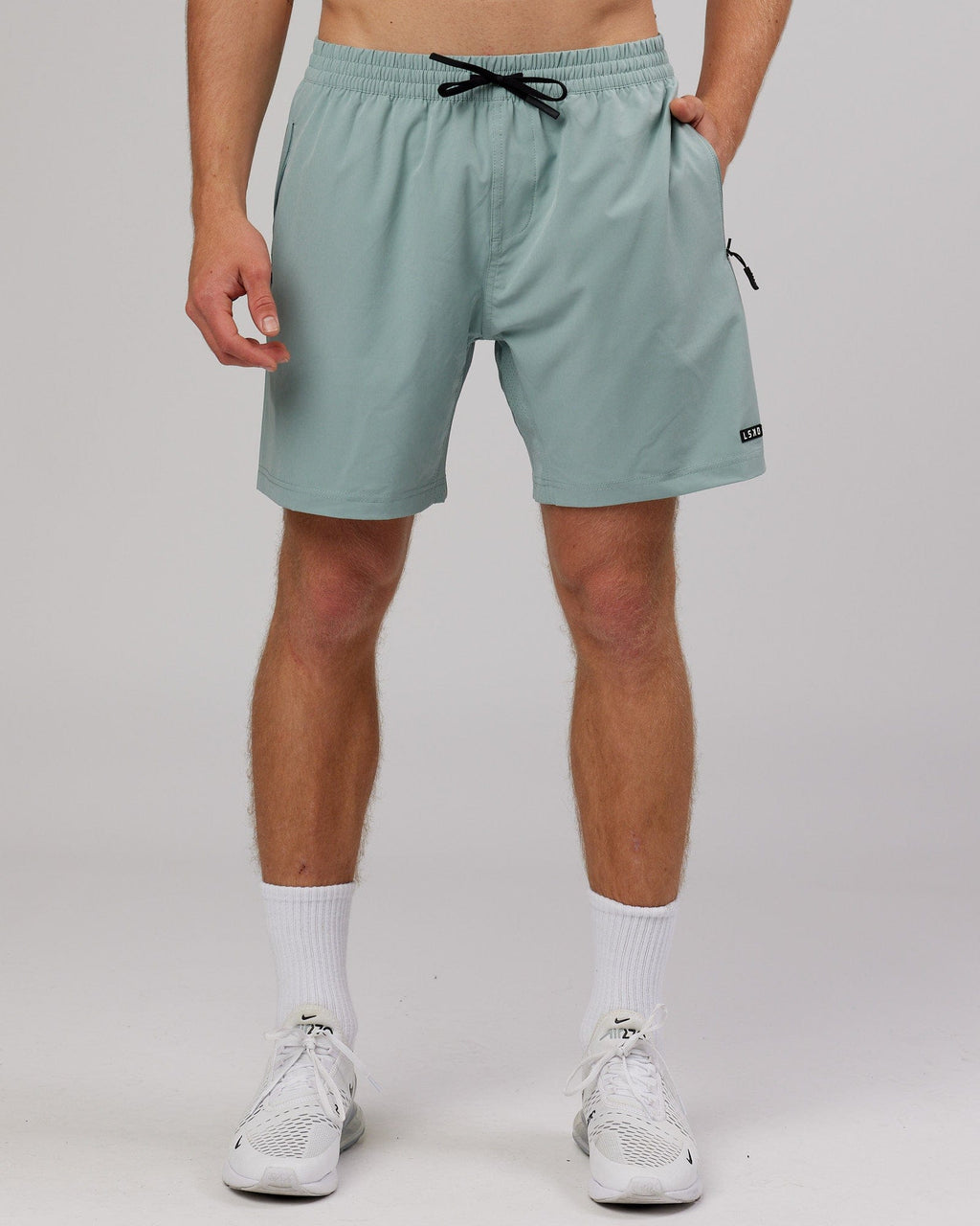Model wearing Rep 7'' Performance Short - Frost