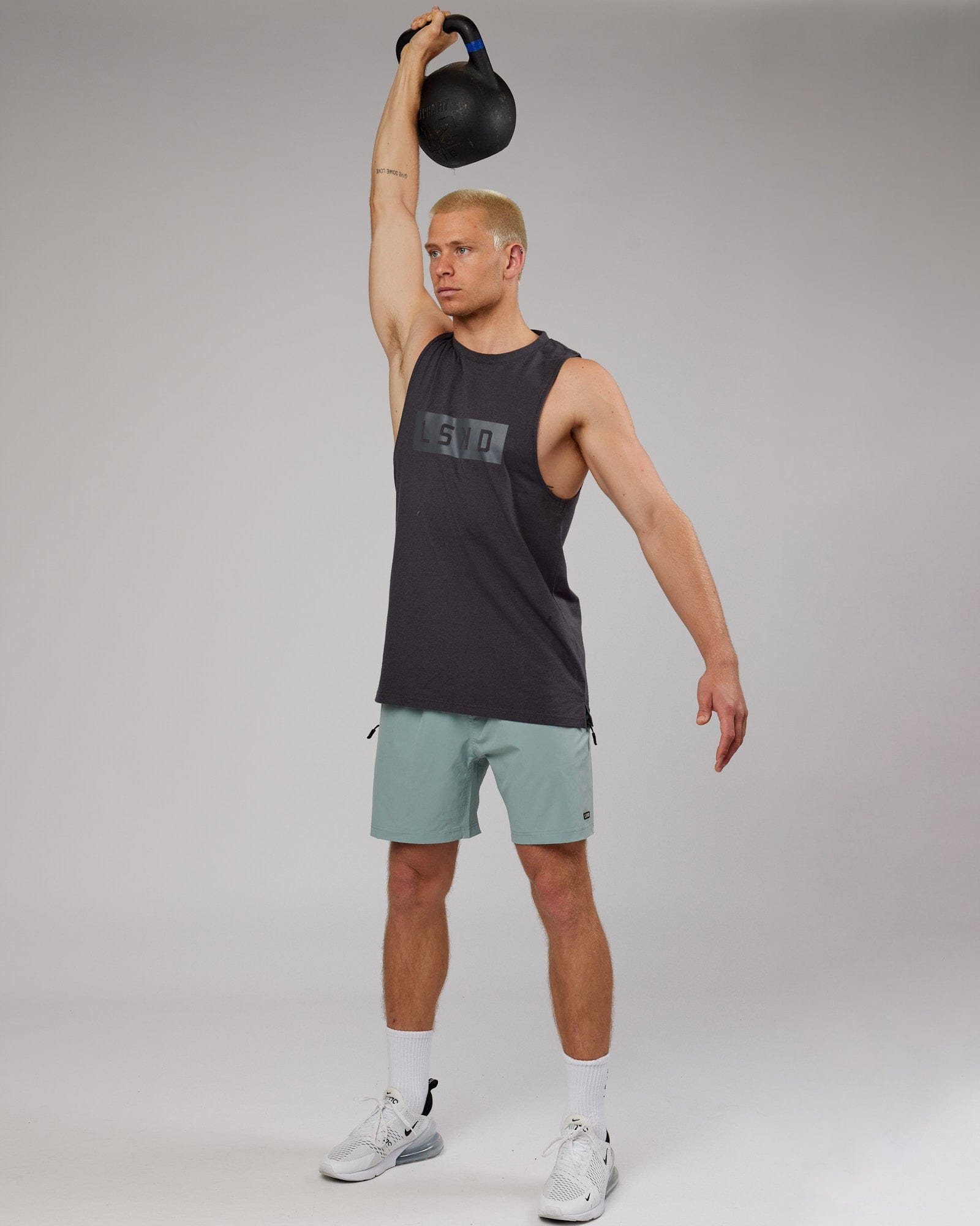 Model wearing Rep 7'' Performance Short - Frost