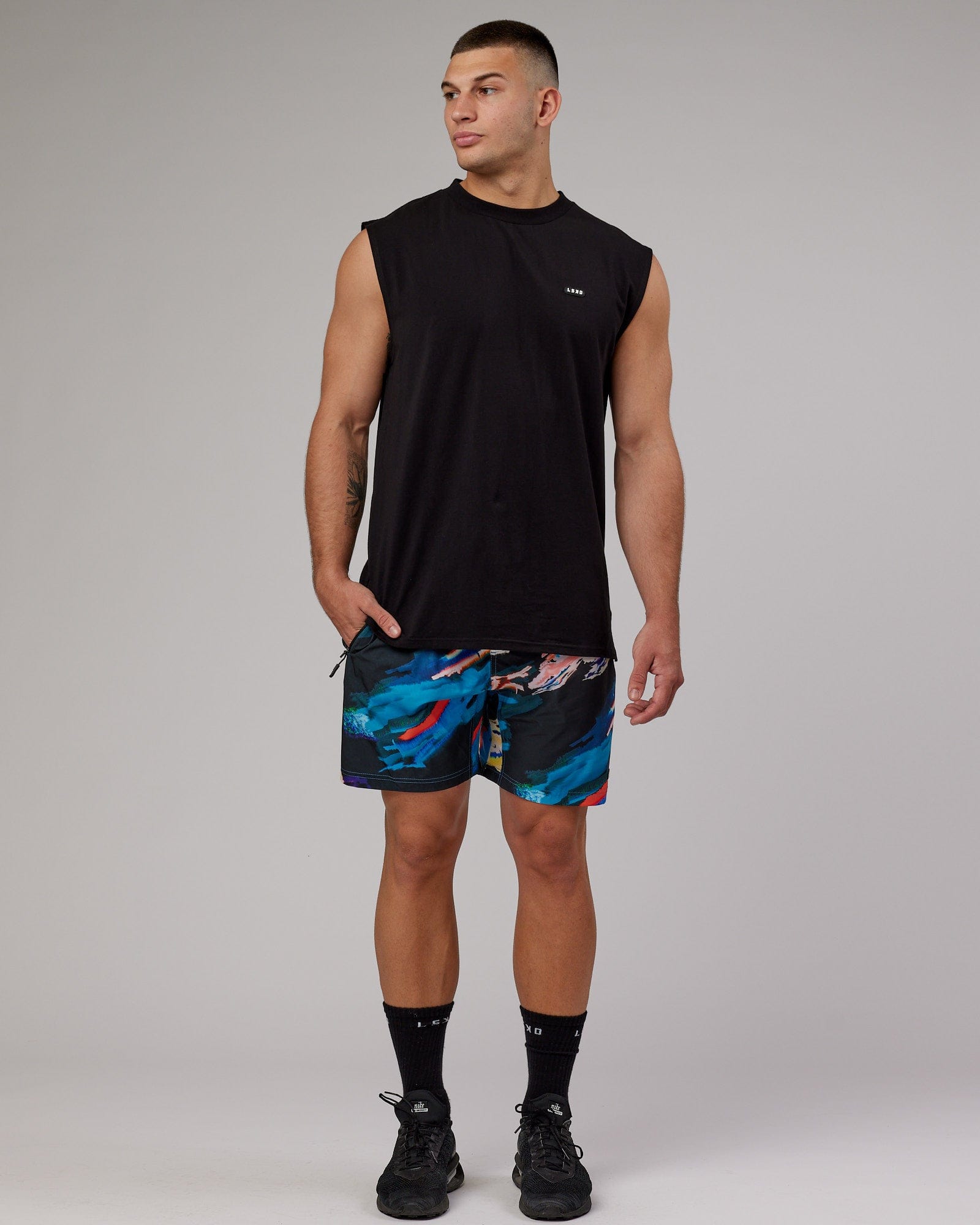 Model wearing Rep 7" Performance Short - Glitch-Black
