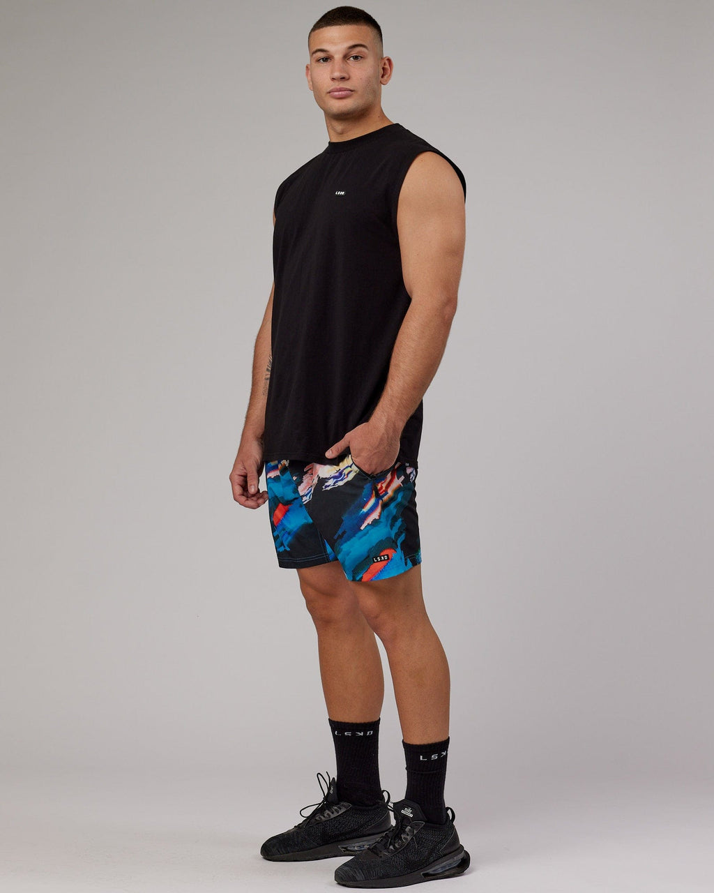 Model wearing Rep 7" Performance Short - Glitch-Black