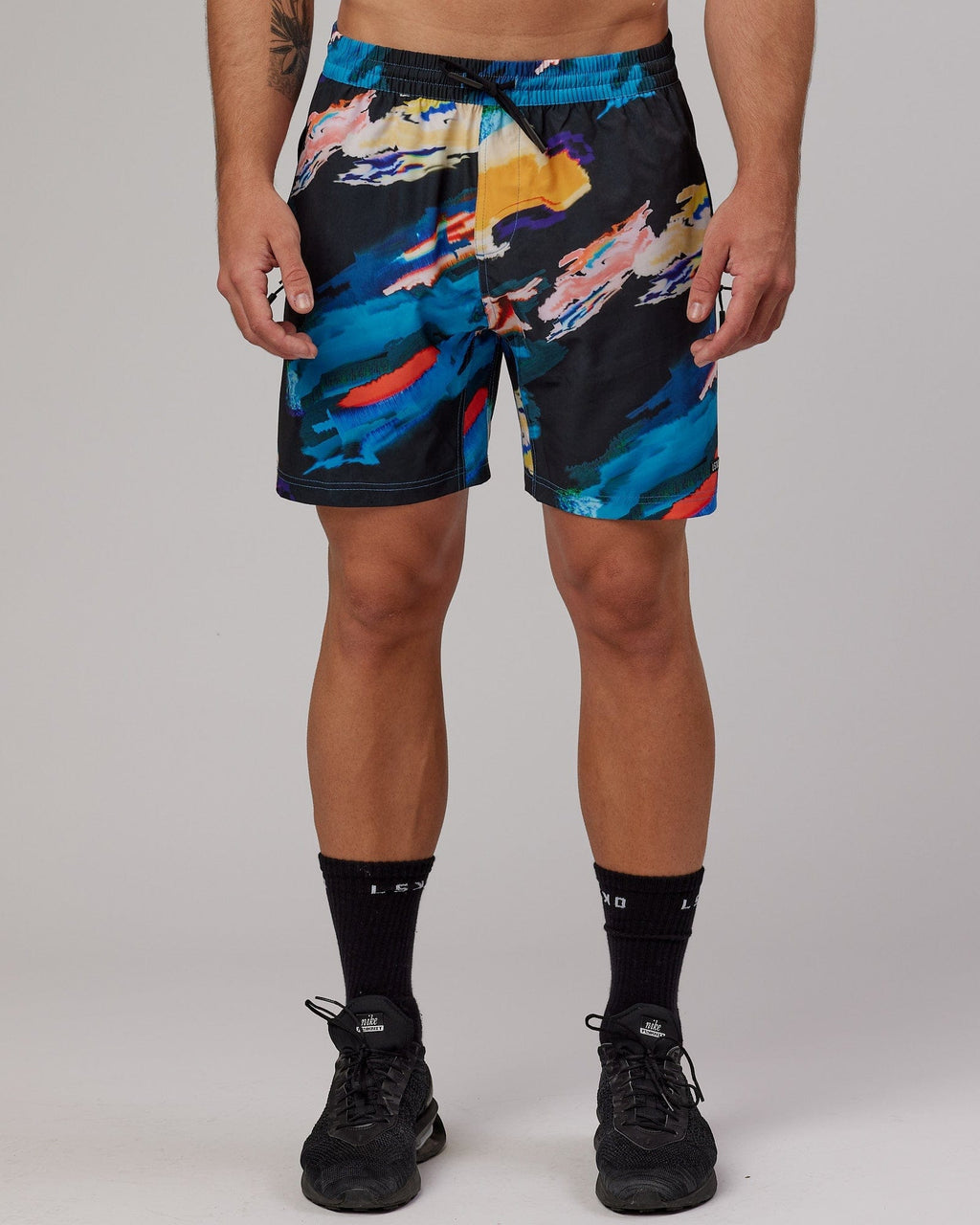 Model wearing Rep 7" Performance Short - Glitch-Black