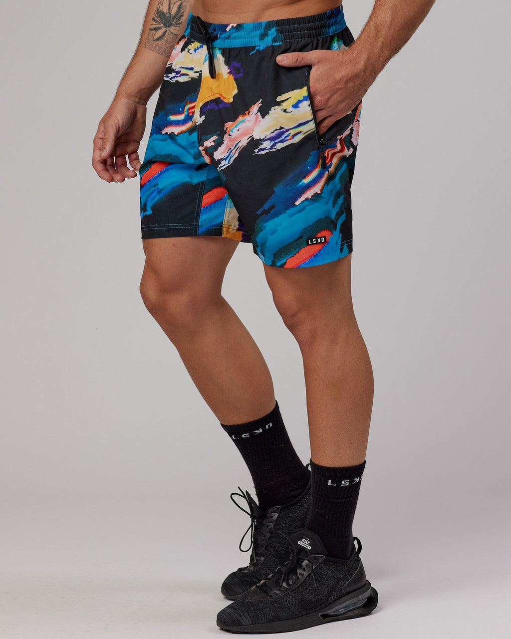 Model wearing Rep 7" Performance Short - Glitch-Black