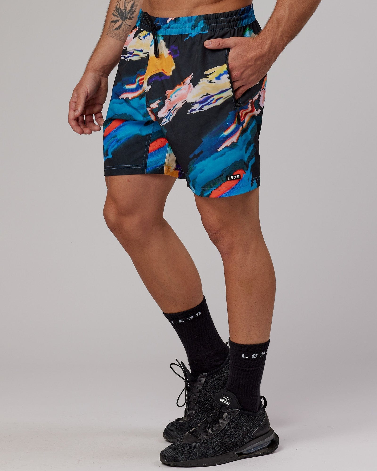 Model wearing Rep 7" Performance Short - Glitch-Black