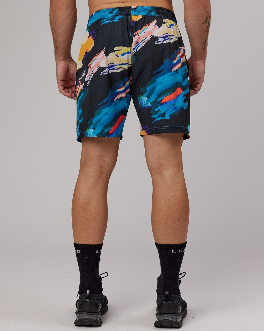 Model wearing Rep 7" Performance Short - Glitch-Black
