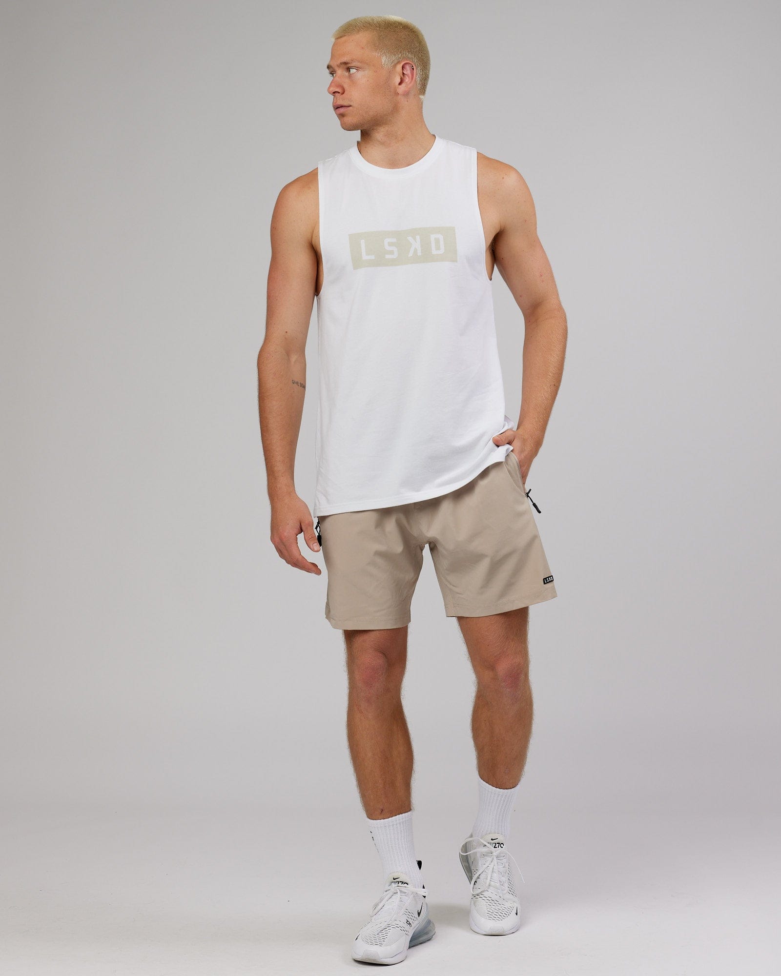 Model wearing Rep 7'' Performance Short - Taupe