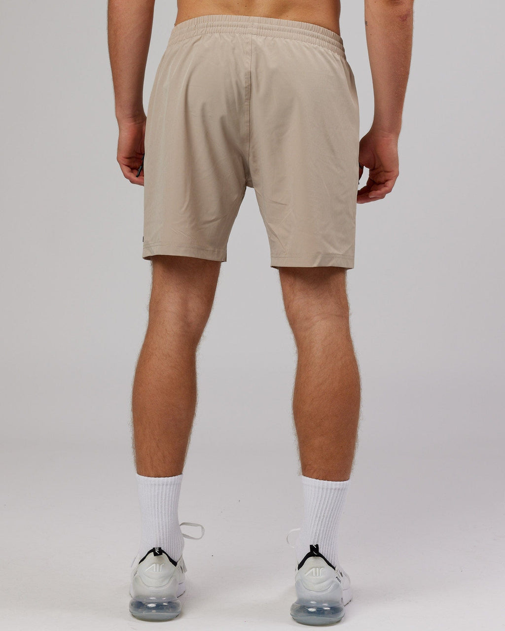 Model wearing Rep 7'' Performance Short - Taupe
