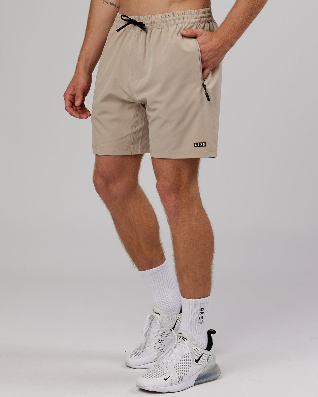 Model wearing Rep 7'' Performance Short - Taupe