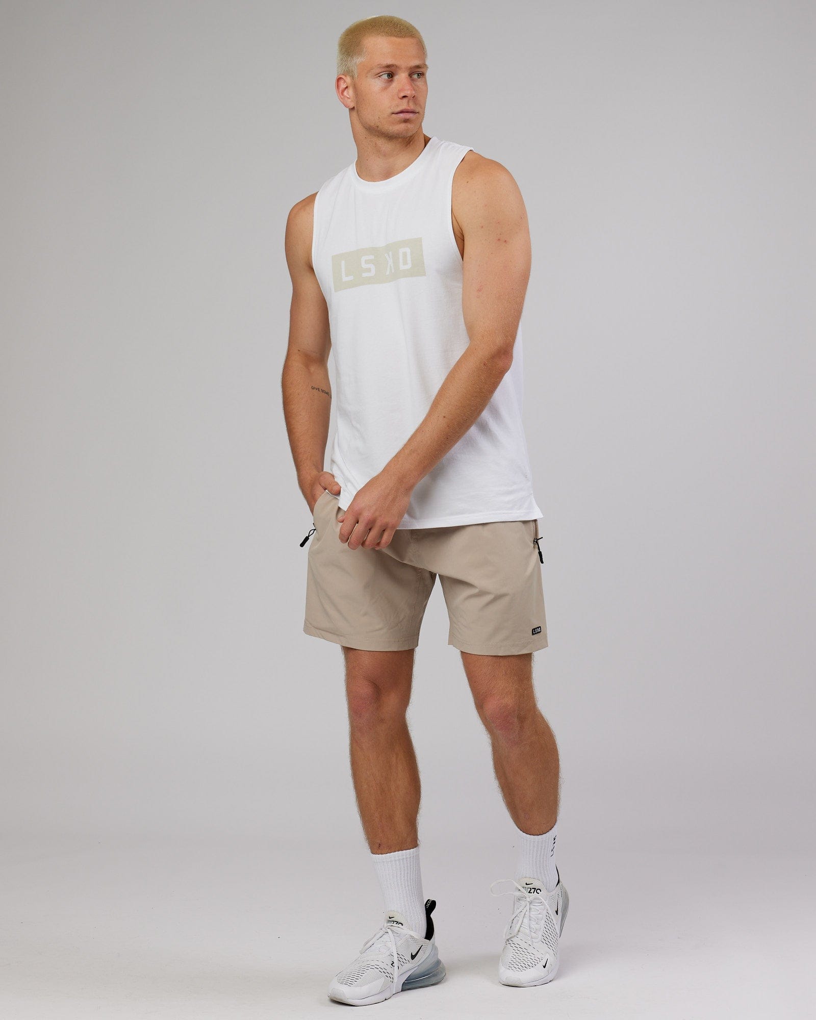 Model wearing Rep 7'' Performance Short - Taupe
