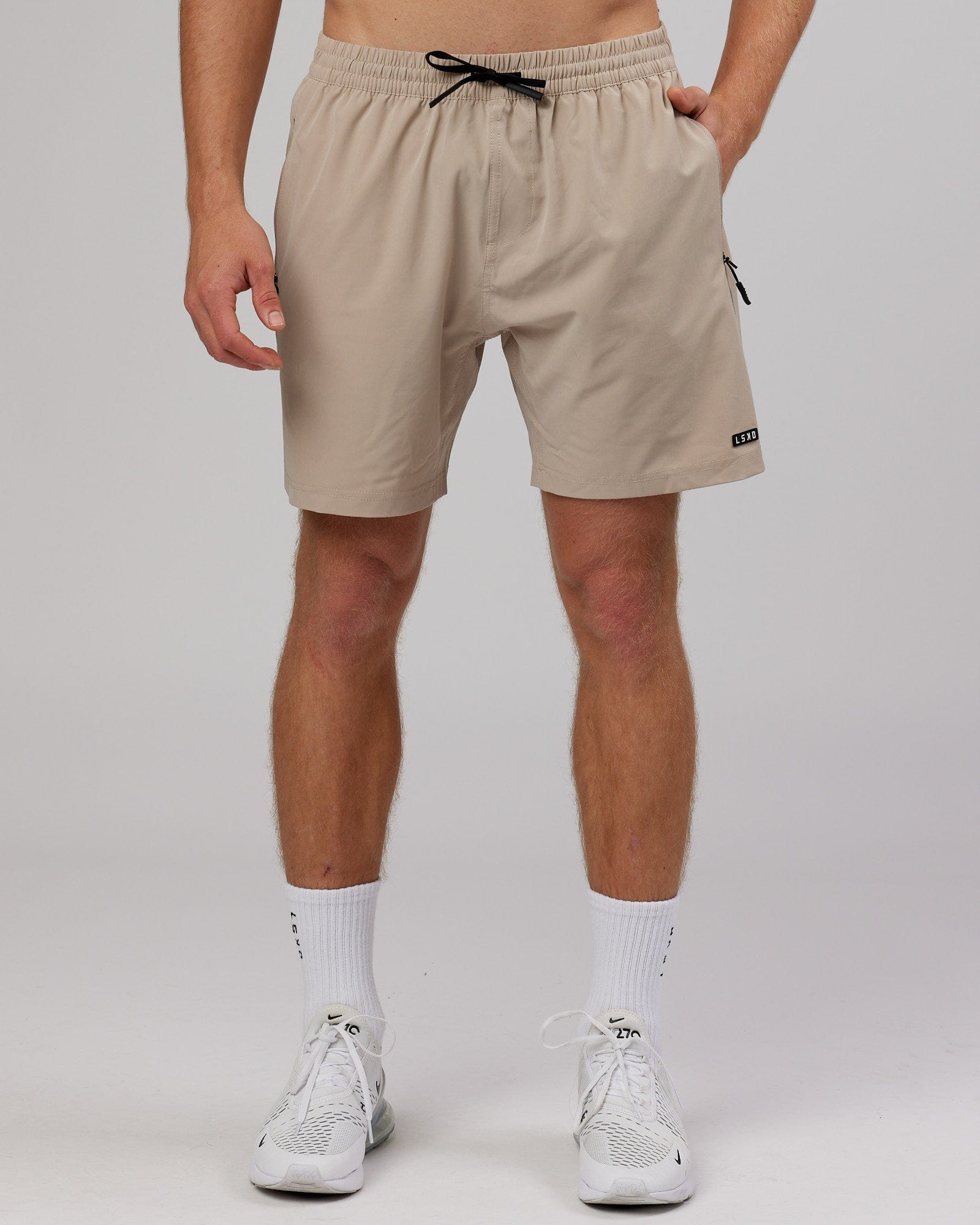 Model wearing Rep 7'' Performance Short - Taupe