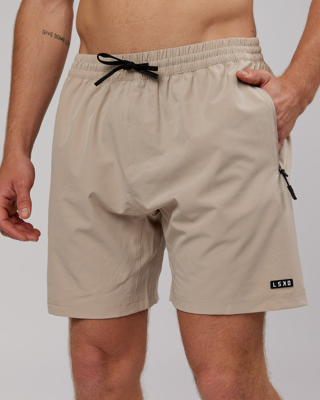 Model wearing Rep 7'' Performance Short - Taupe