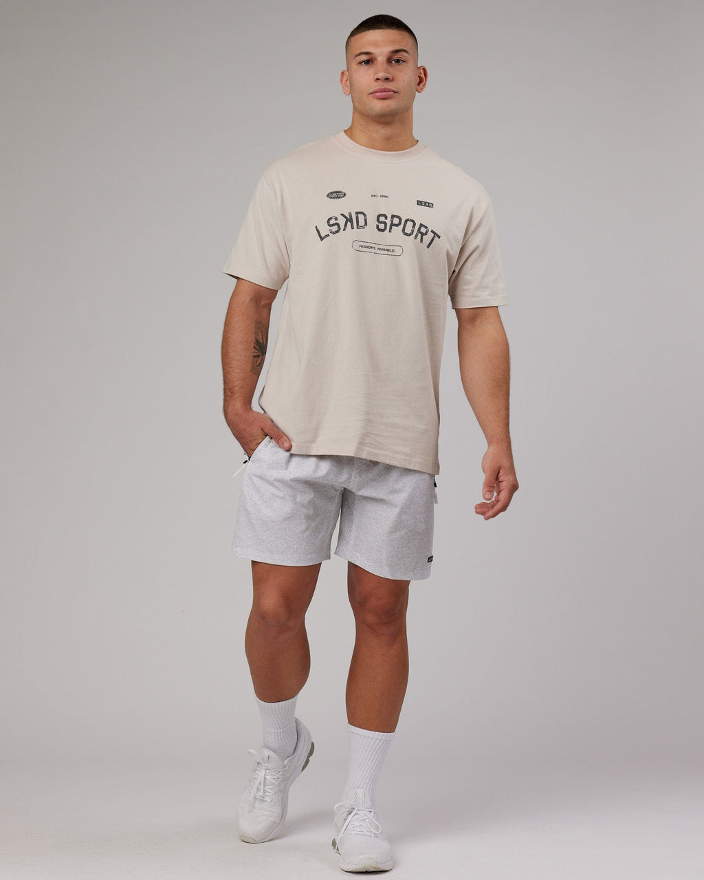 Model wearing Rep 7'' Performance Short - White Etching