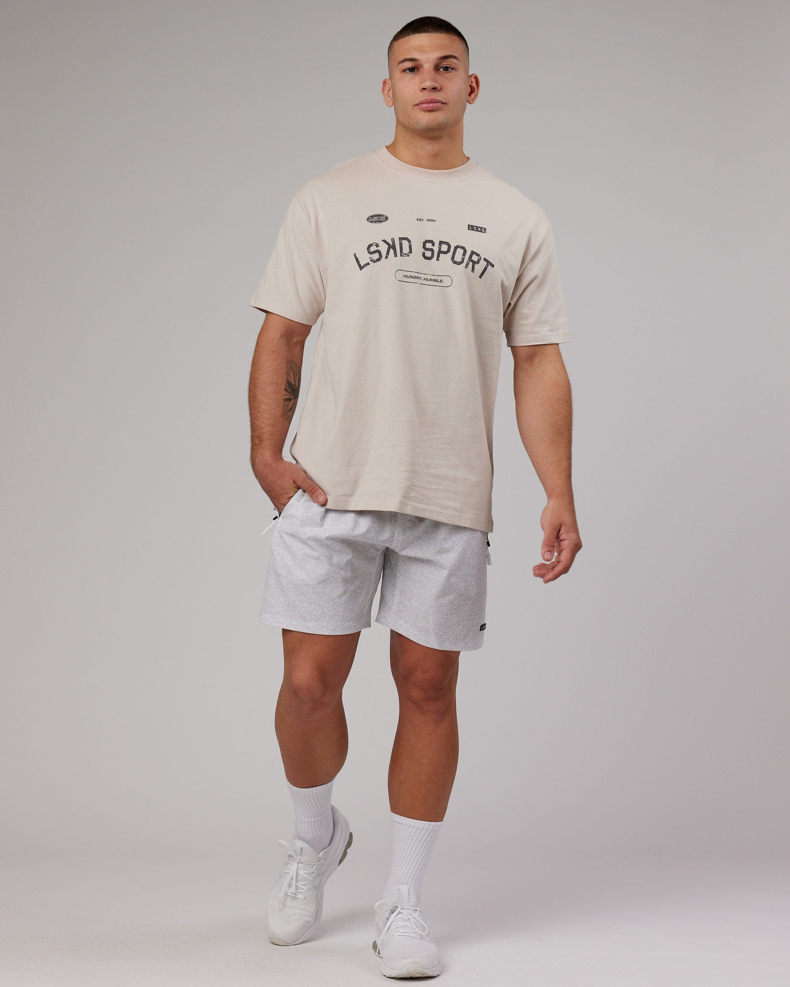 Model wearing Rep 7'' Performance Short - White Etching