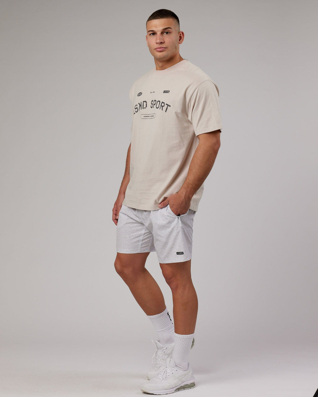 Model wearing Rep 7'' Performance Short - White Etching