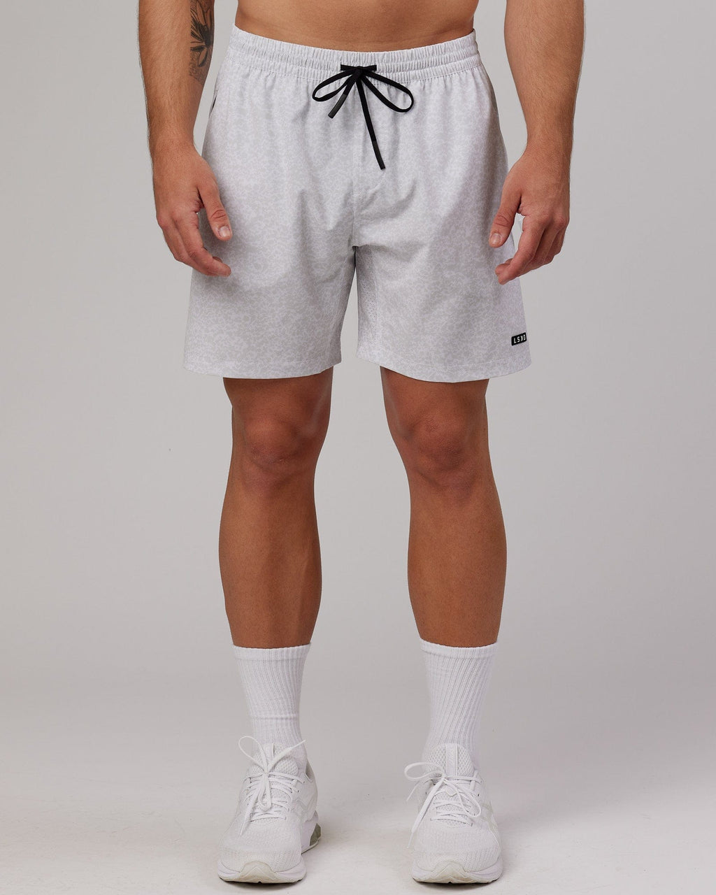 Model wearing Rep 7'' Performance Short - White Etching