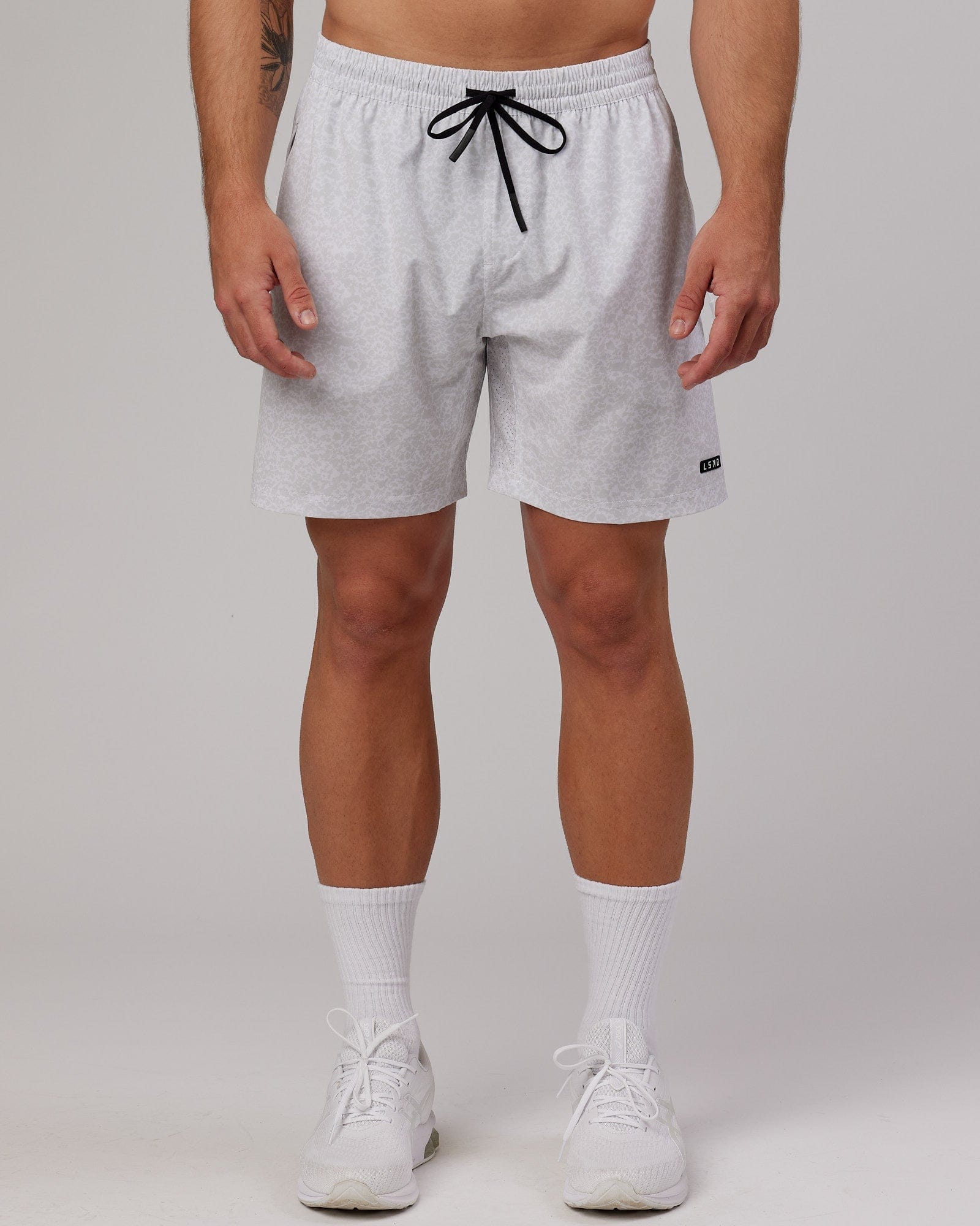 Model wearing Rep 7'' Performance Short - White Etching