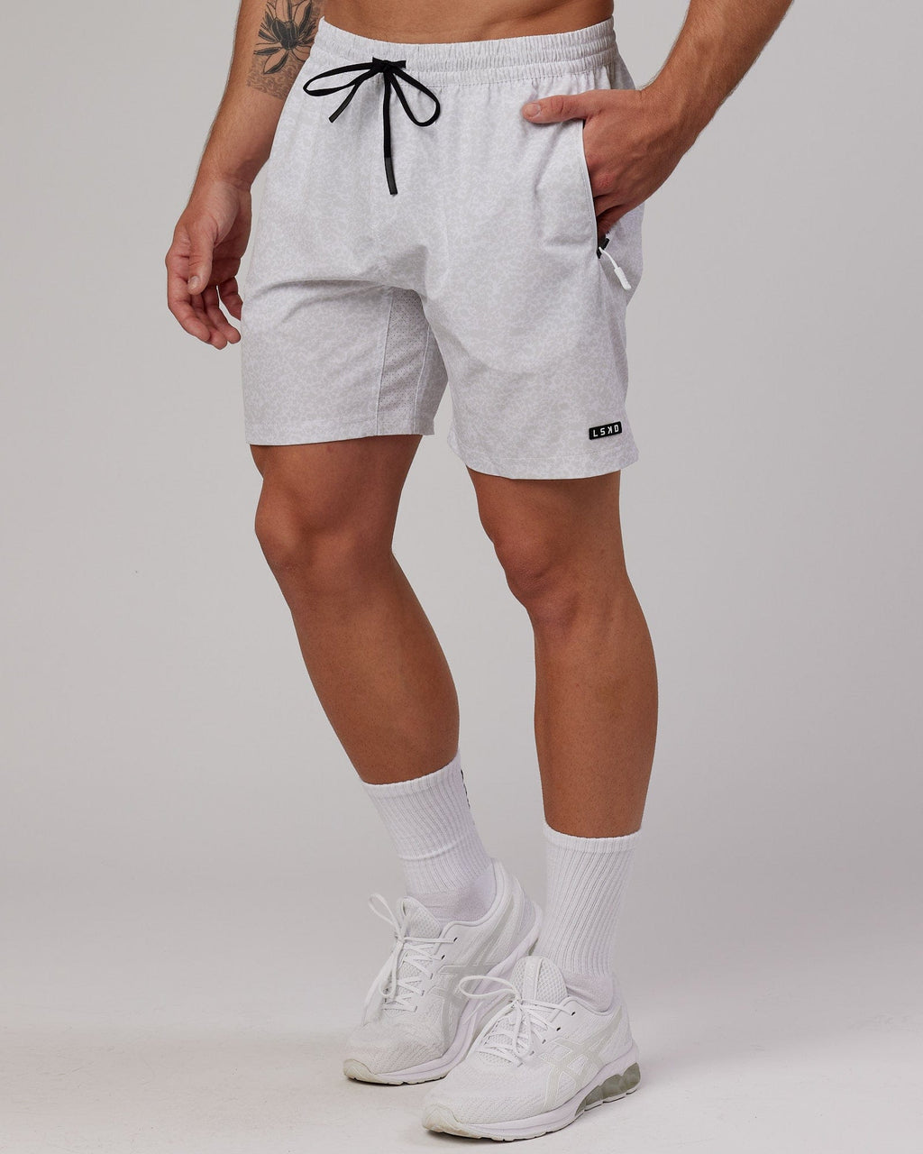 Model wearing Rep 7'' Performance Short - White Etching