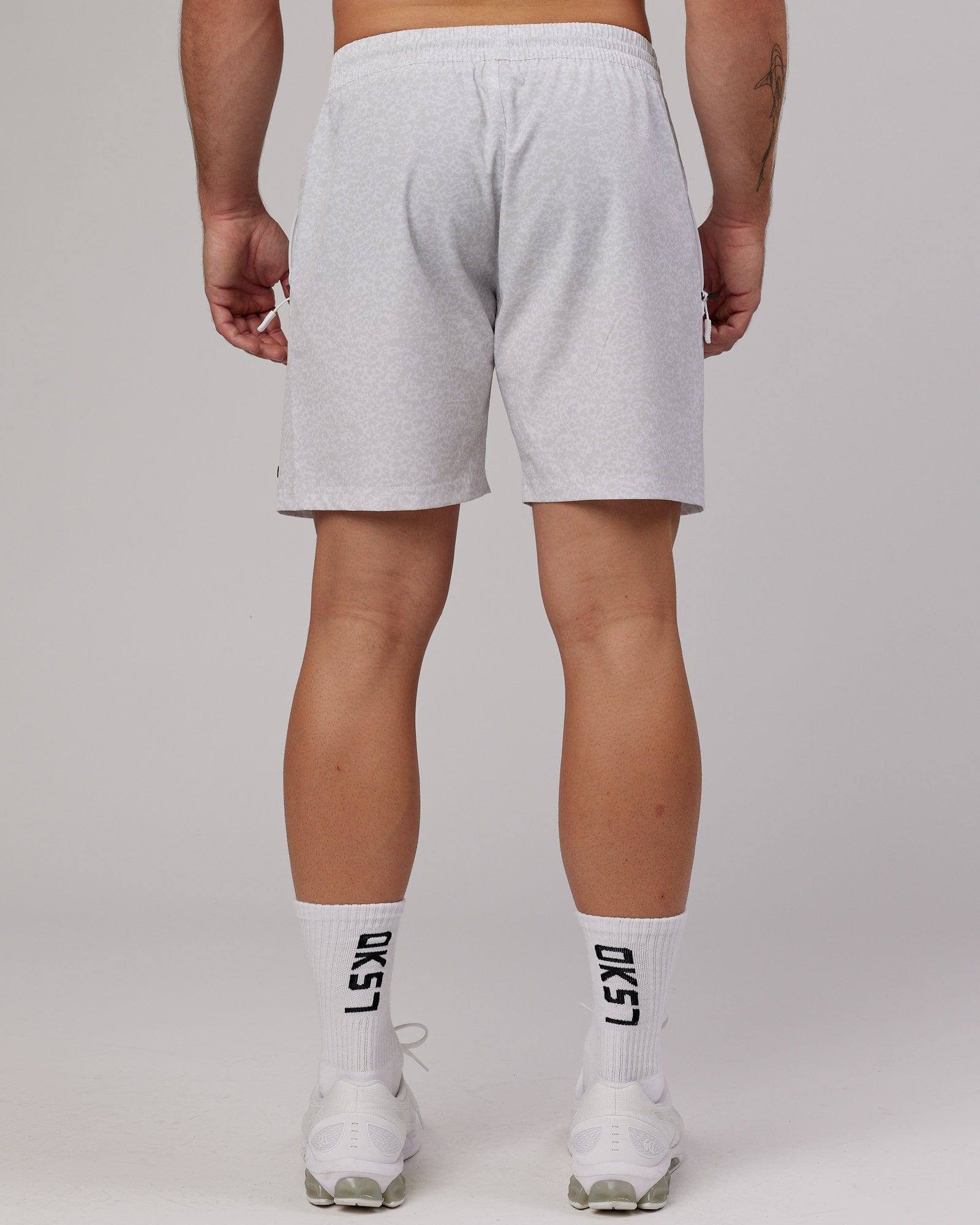 Model wearing Rep 7'' Performance Short - White Etching