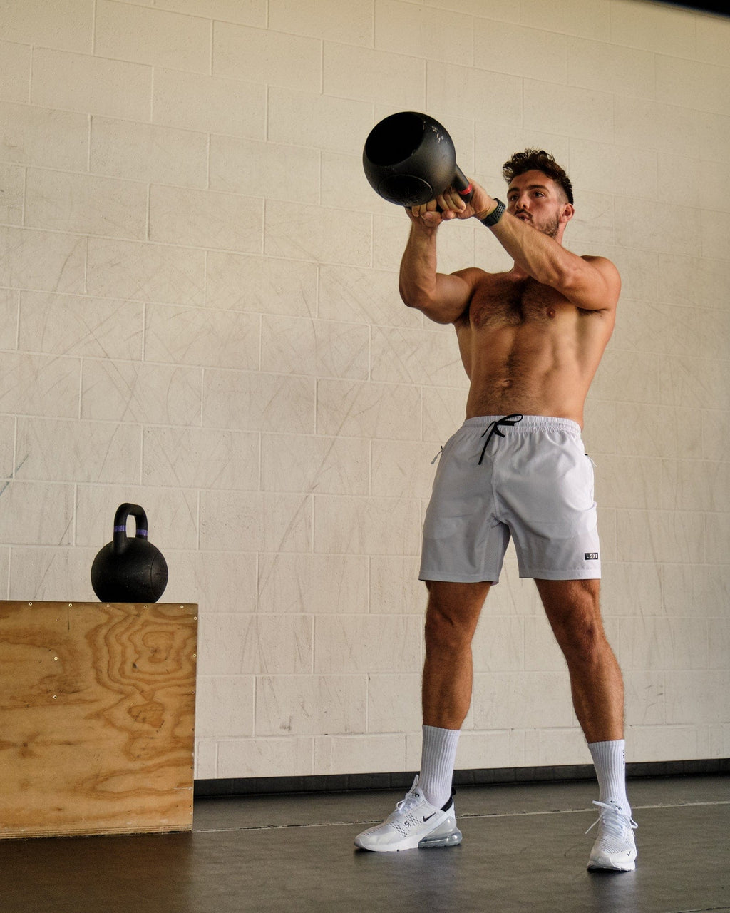 Model wearing Rep 7" Performance Short - White