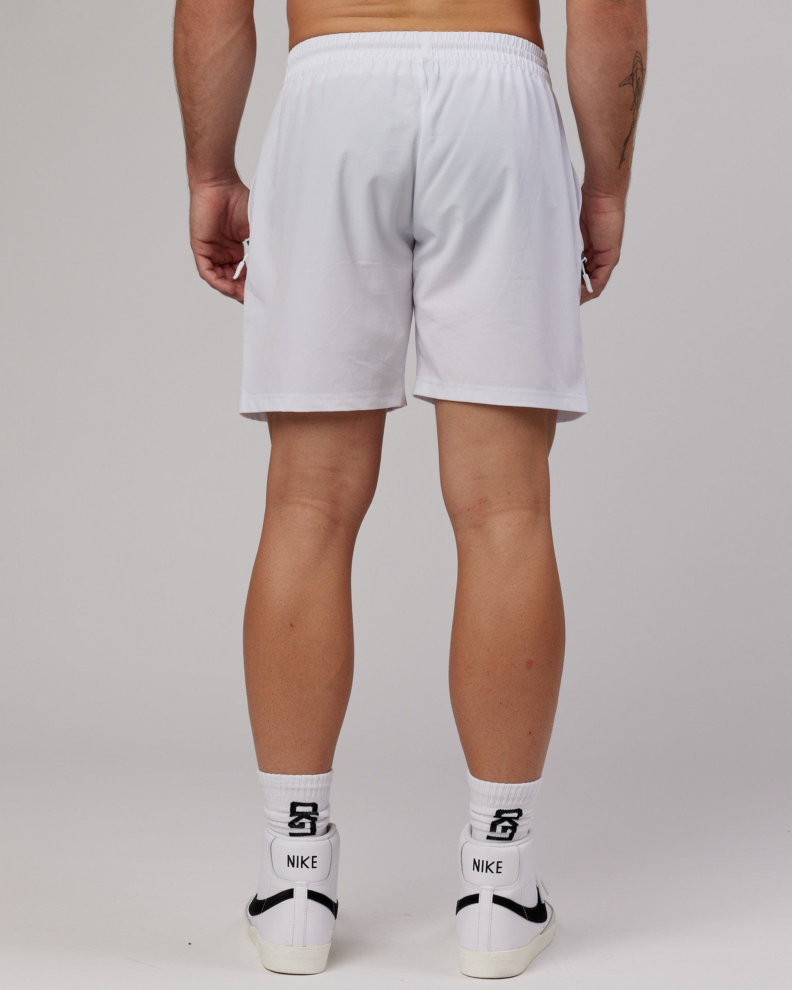 Model wearing Rep 7" Performance Short - White