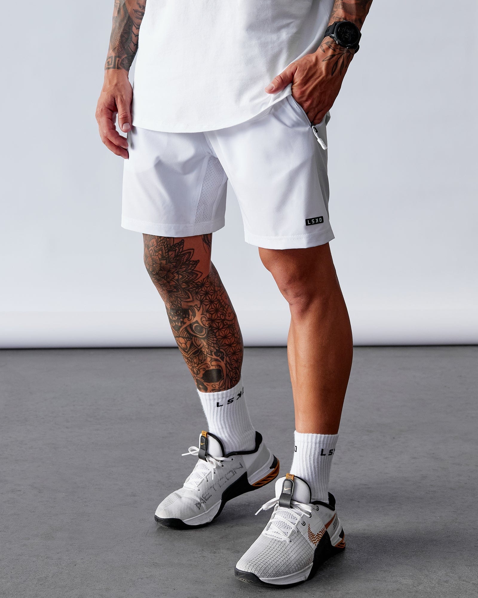 Model wearing Rep 7" Performance Short - White