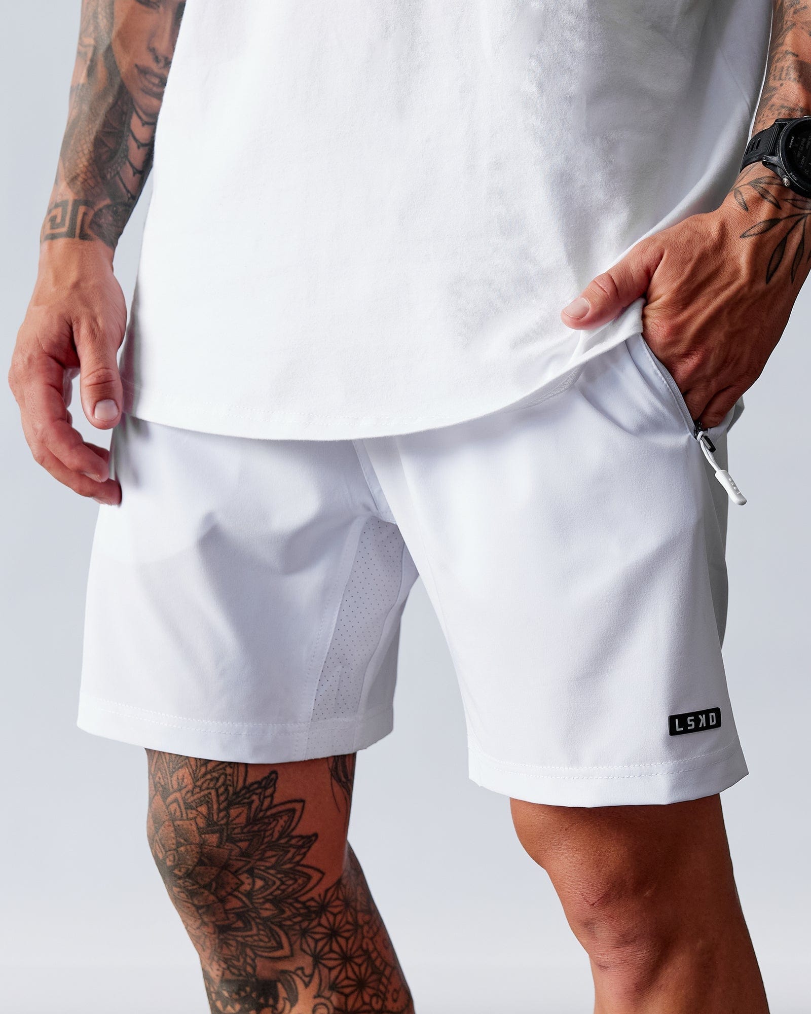 Model wearing Rep 7" Performance Short - White