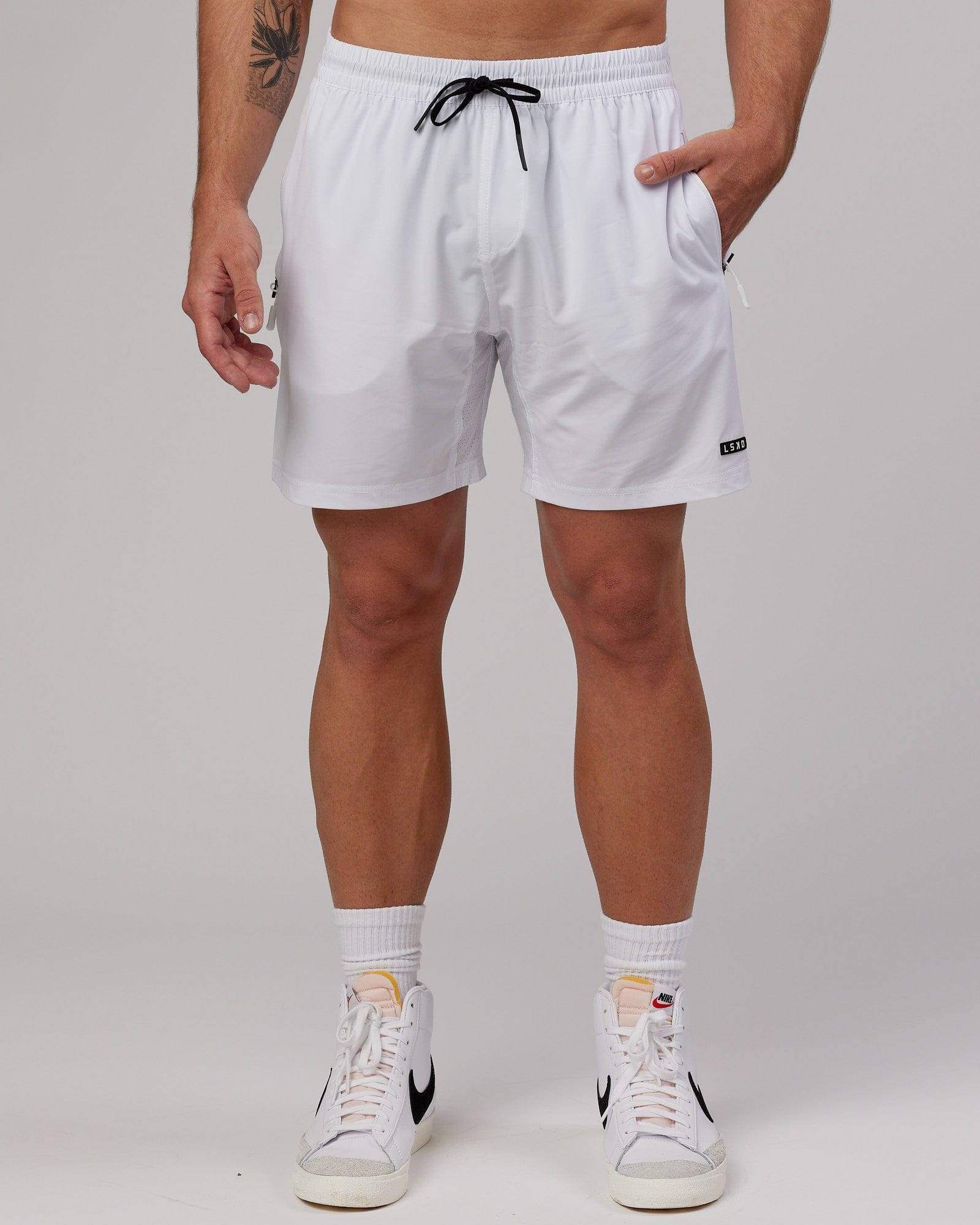 Model wearing Rep 7" Performance Short - White