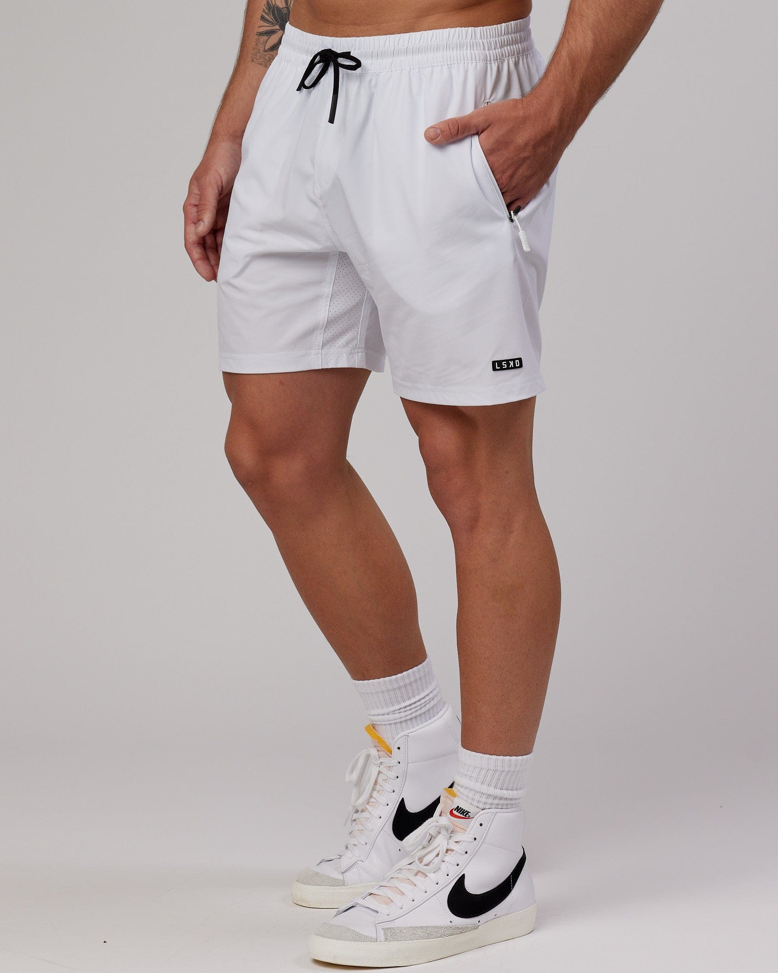 Model wearing Rep 7" Performance Short - White