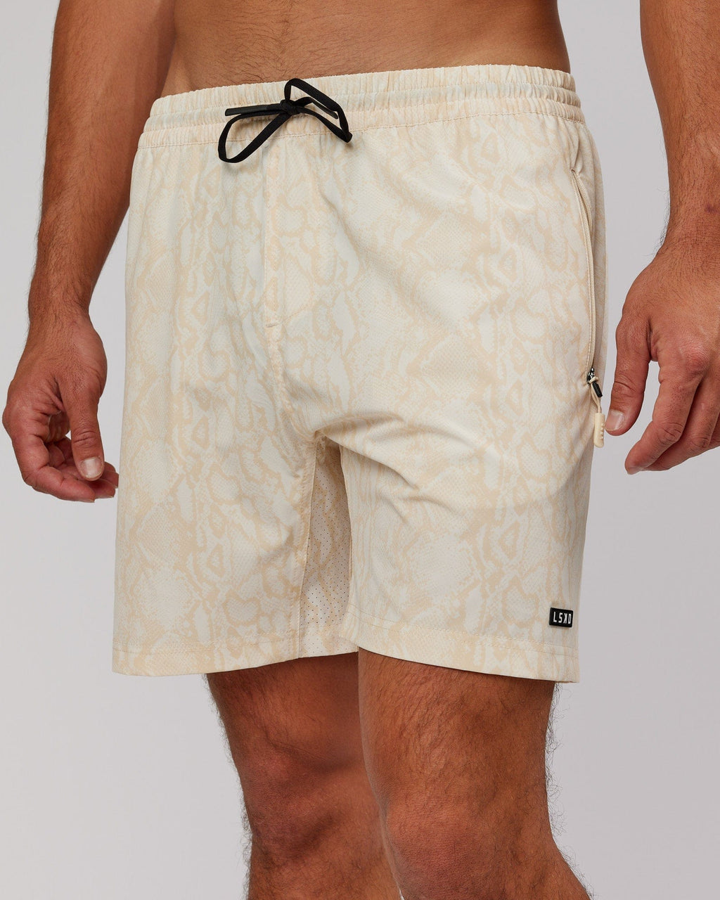 Model wearing Rep 7'' Performance Short - Almond Snakeskin