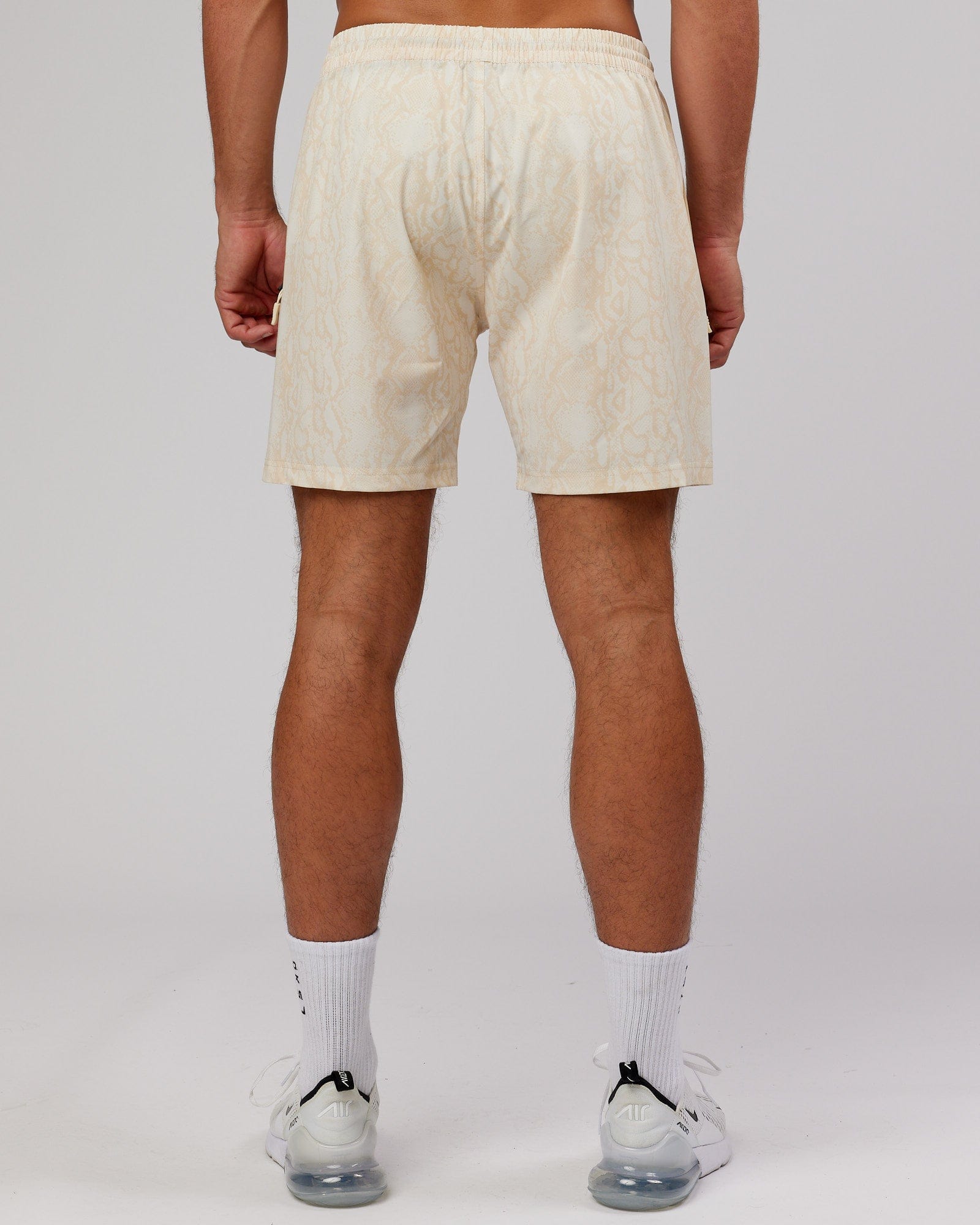 Model wearing Rep 7'' Performance Short - Almond Snakeskin