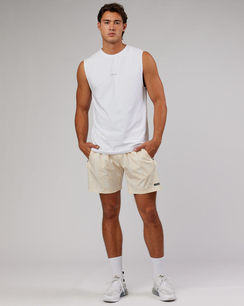 Model wearing Rep 7'' Performance Short - Almond Snakeskin
