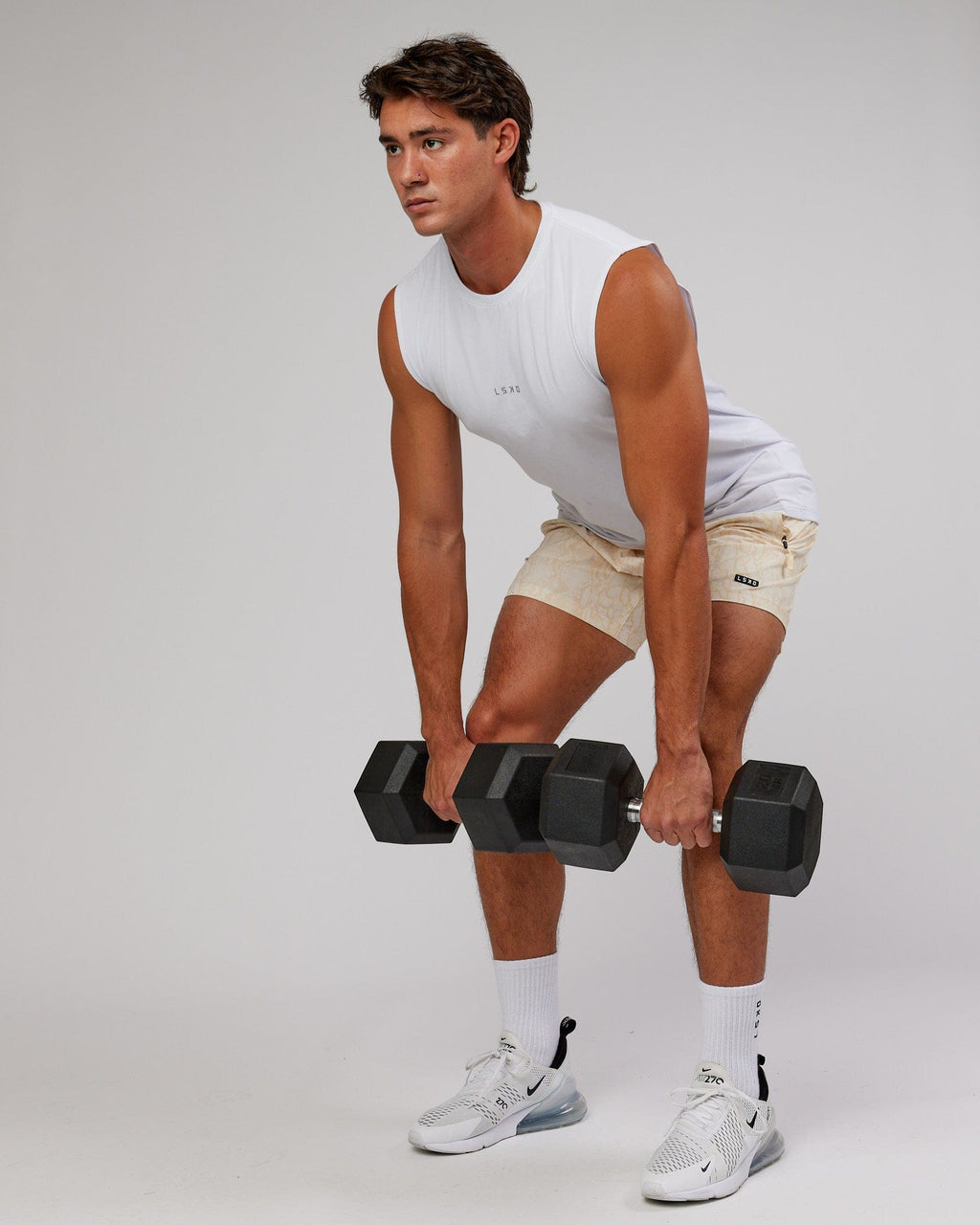 Model wearing Rep 7'' Performance Short - Almond Snakeskin