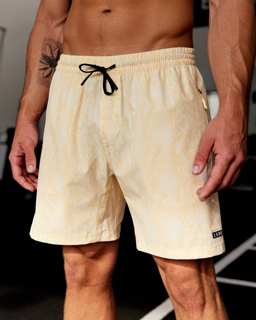 Model wearing Rep 7'' Performance Short - Almond Snakeskin