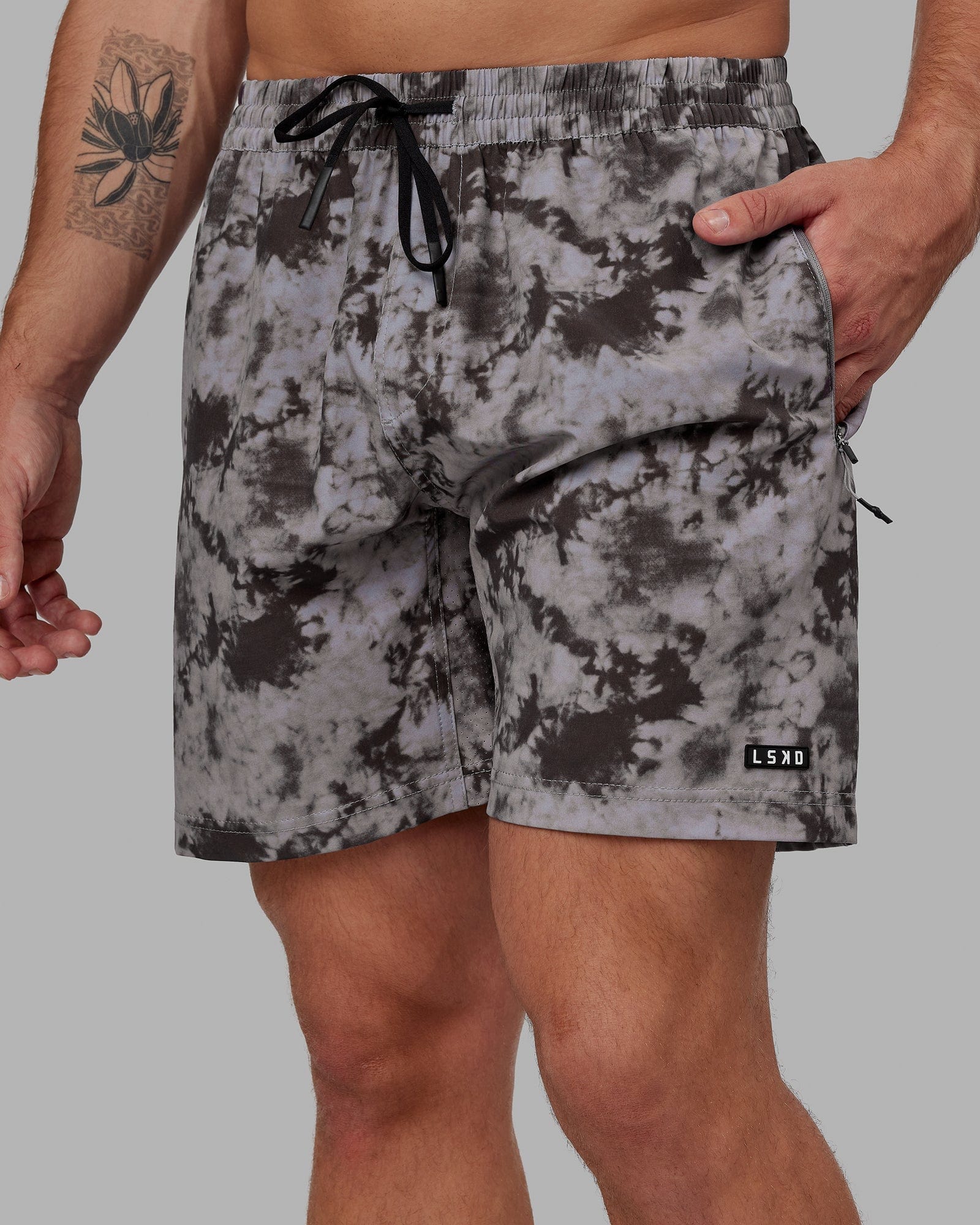 Model wearing Rep 7'' Performance Short - Asphalt Tie Dye
