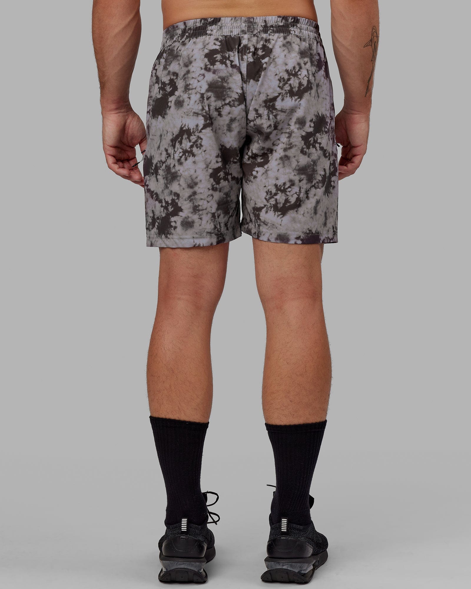 Model wearing Rep 7'' Performance Short - Asphalt Tie Dye