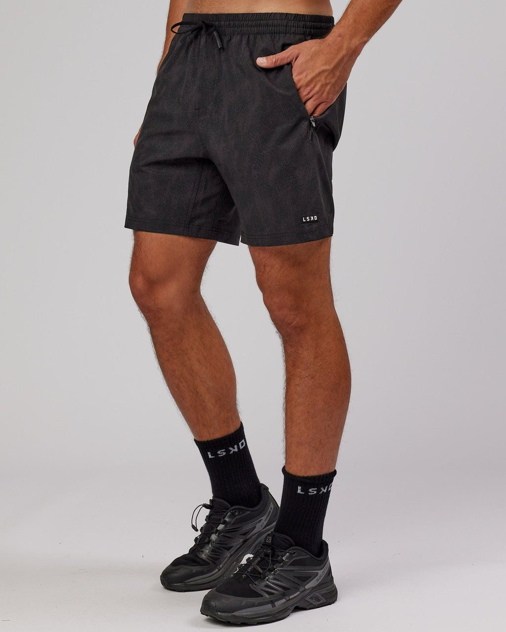 Model wearing Rep 7'' Performance Short - Black Atom