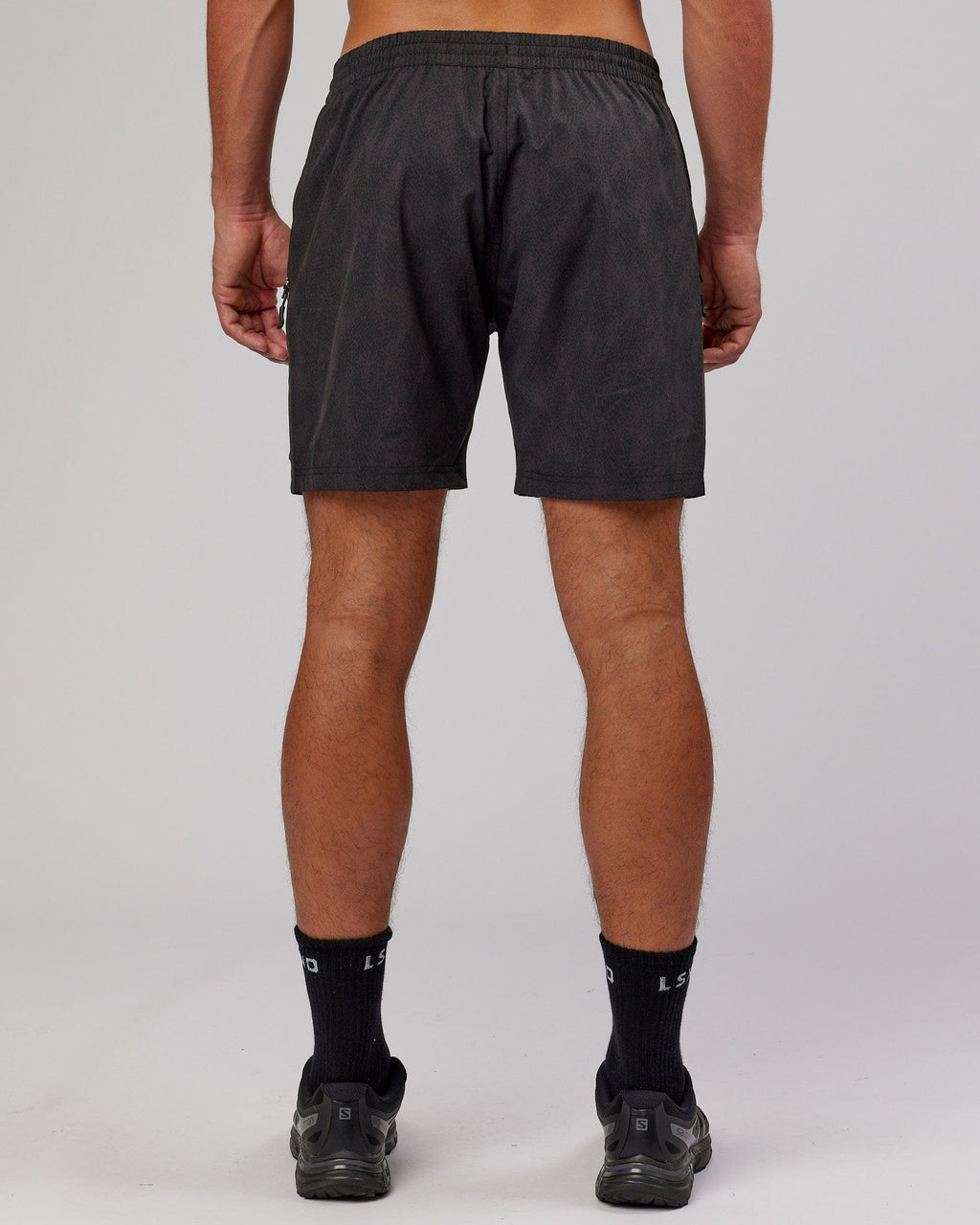 Model wearing Rep 7'' Performance Short - Black Atom