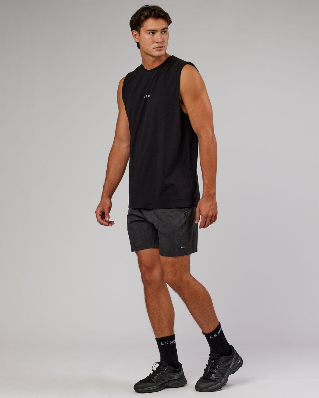 Model wearing Rep 7'' Performance Short - Black Atom