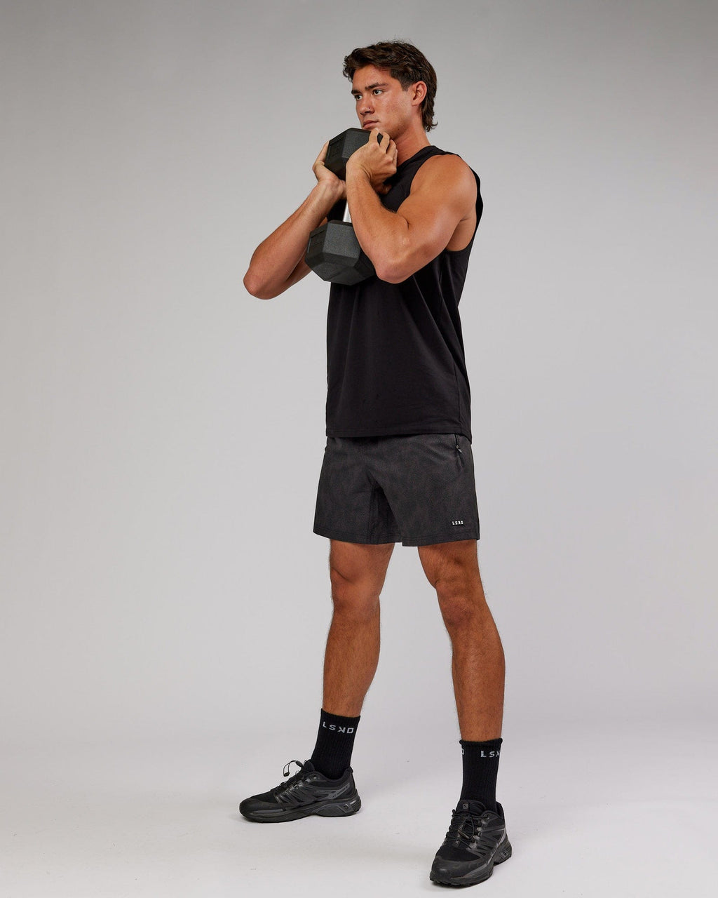 Model wearing Rep 7'' Performance Short - Black Atom