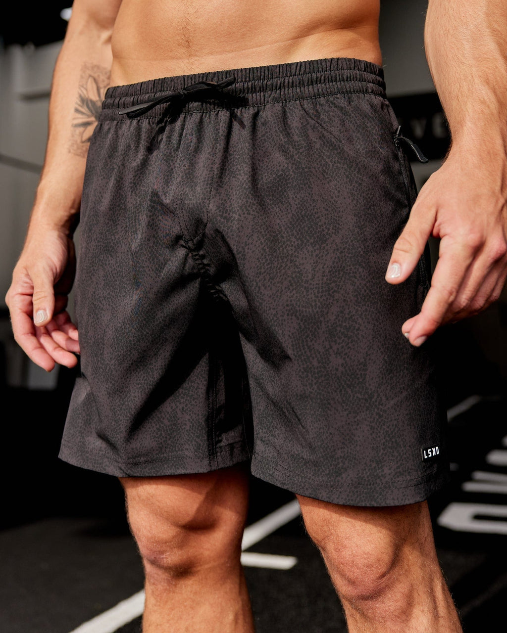 Model wearing Rep 7'' Performance Short - Black Atom