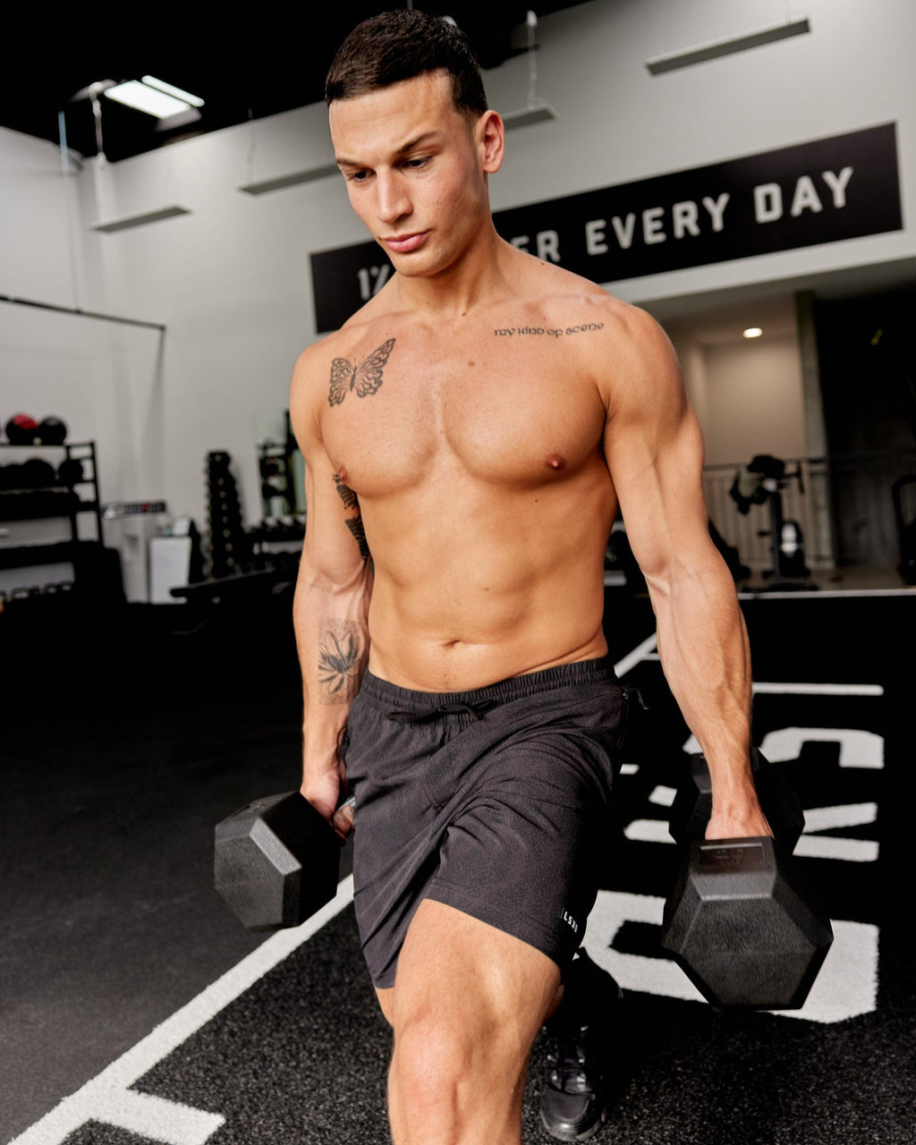 Model wearing Rep 7'' Performance Short - Black Atom