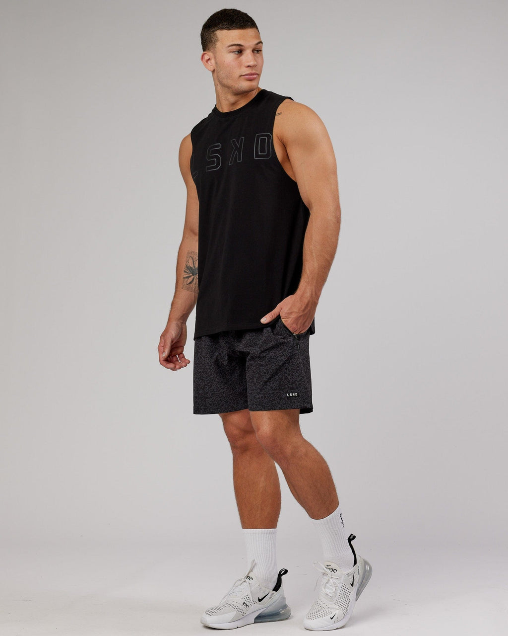 Model wearing Rep 7" Performance Short - Black Etching