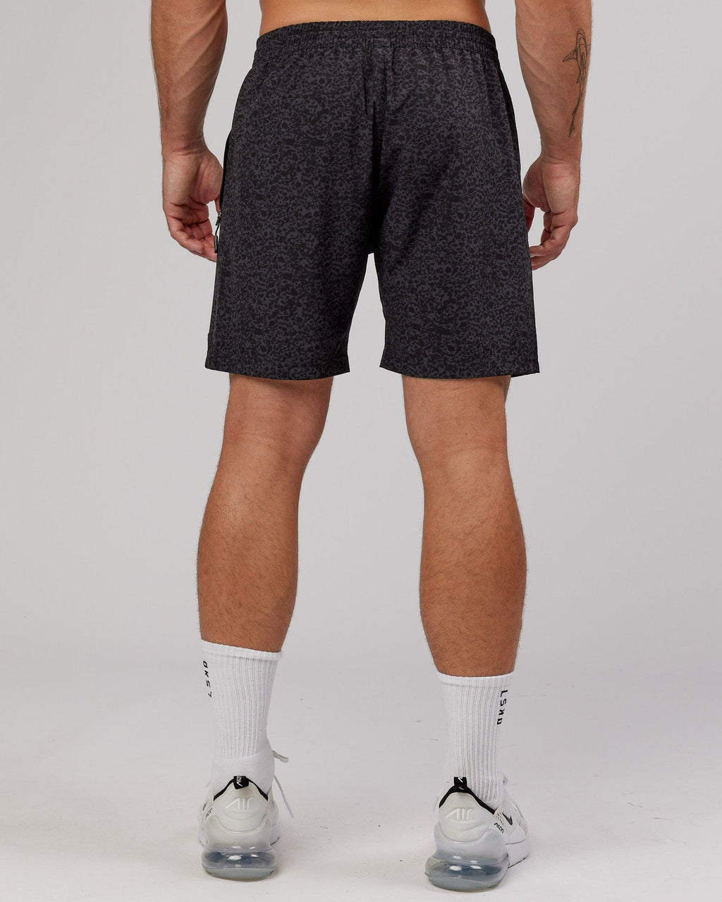 Model wearing Rep 7" Performance Short - Black Etching