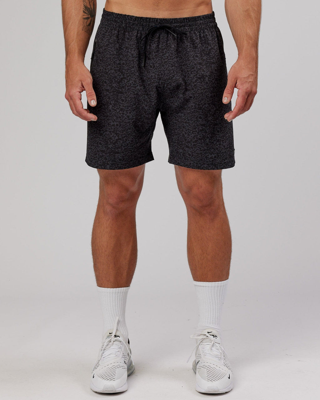 Model wearing Rep 7" Performance Short - Black Etching