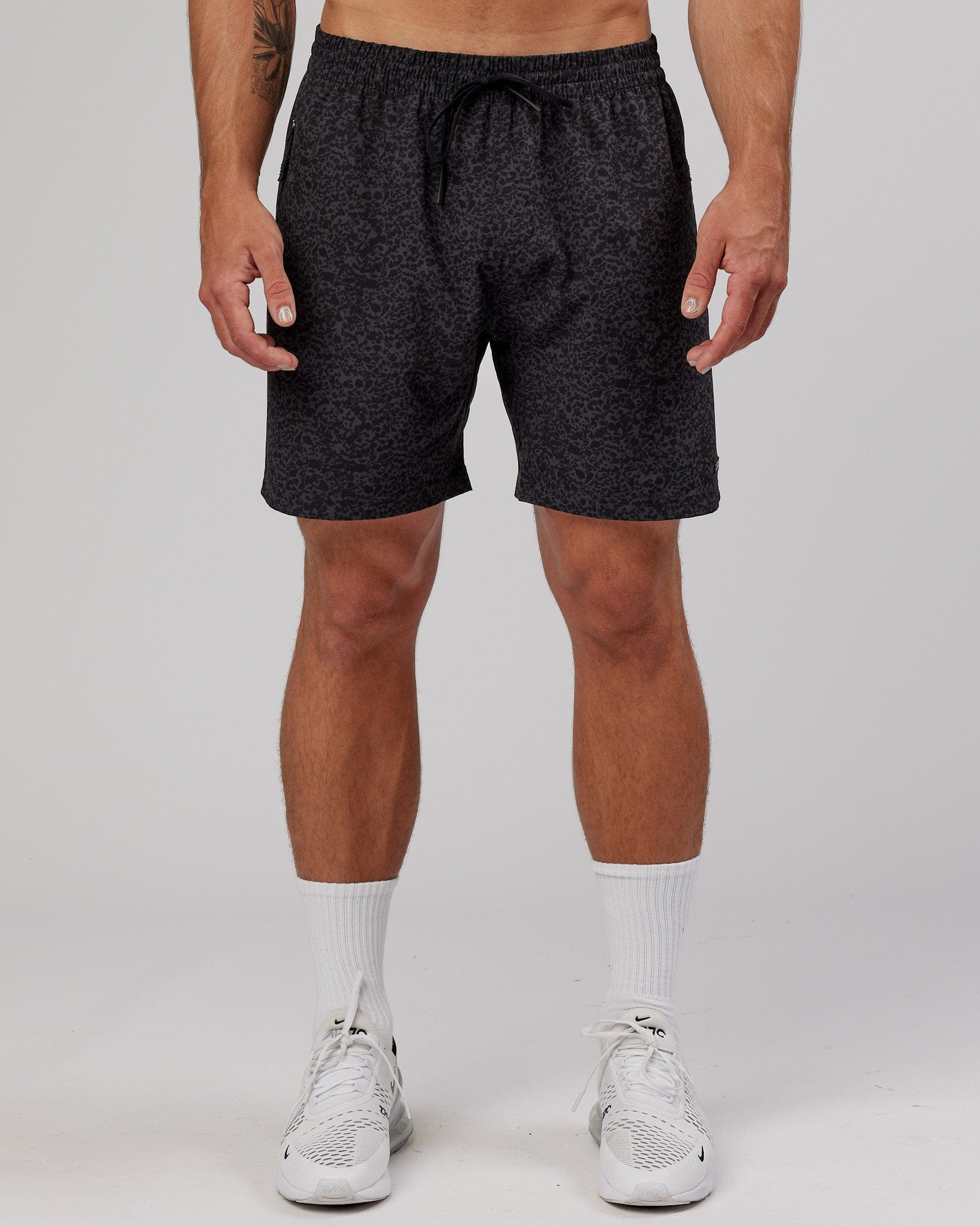 Model wearing Rep 7" Performance Short - Black Etching
