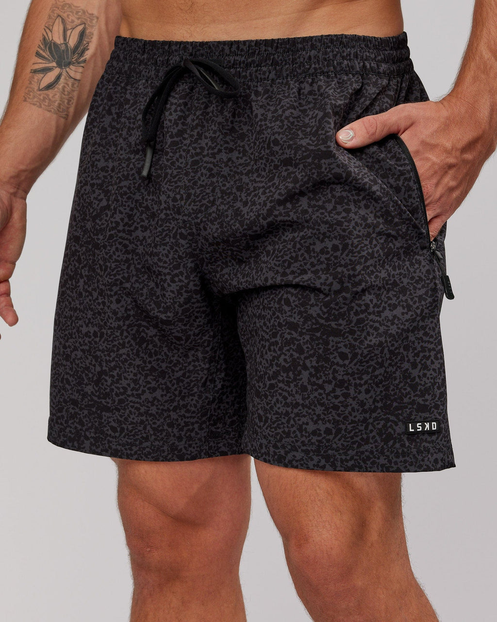 Model wearing Rep 7" Performance Short - Black Etching