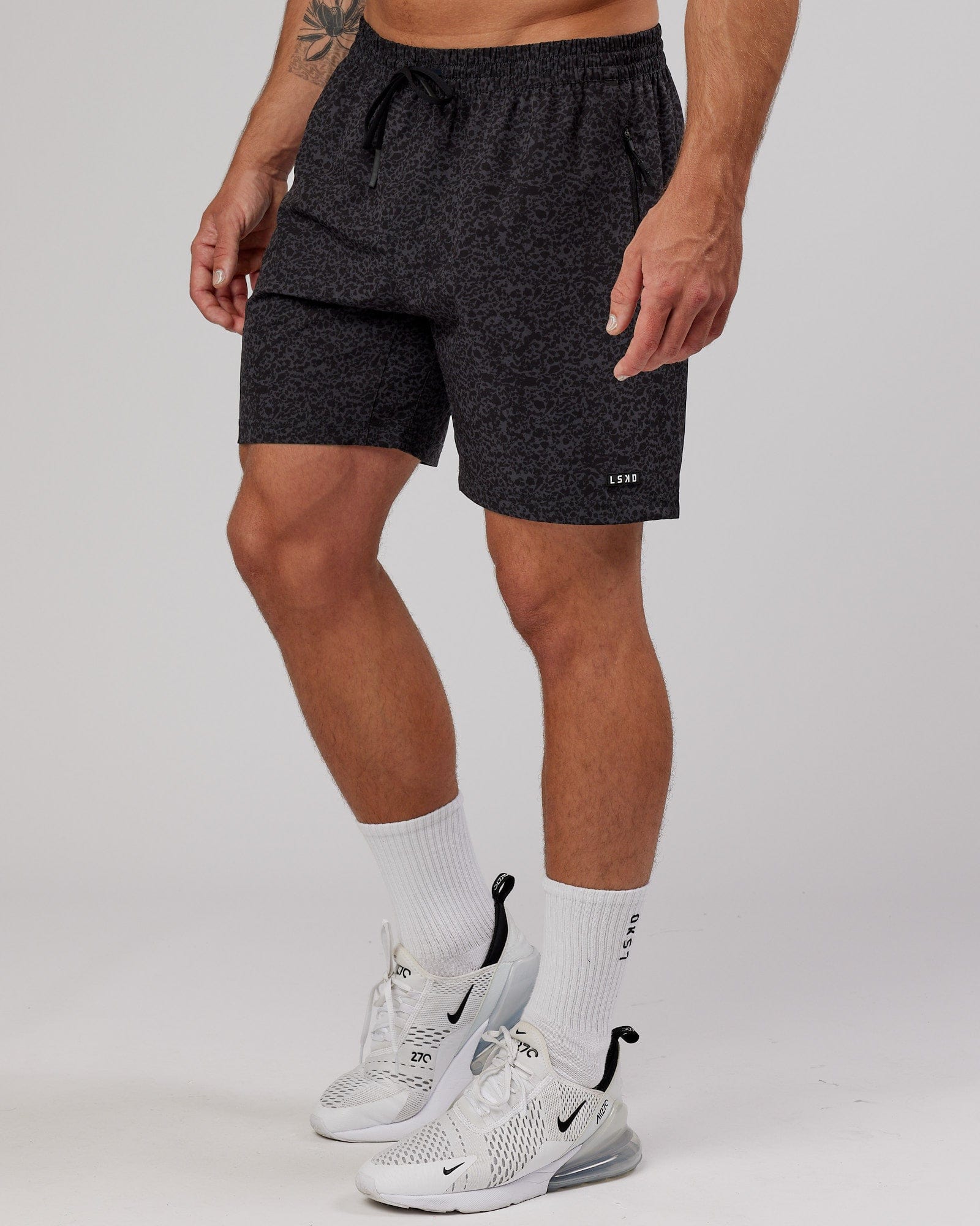Model wearing Rep 7" Performance Short - Black Etching