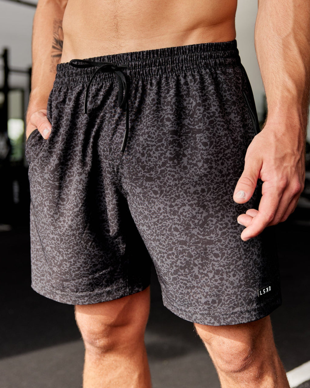 Model wearing Rep 7" Performance Short - Black Etching