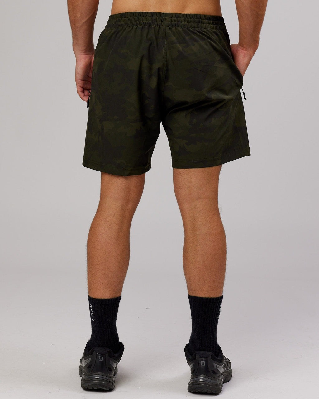 Model wearing Rep 7" Performance Short - Dark Olive Camo