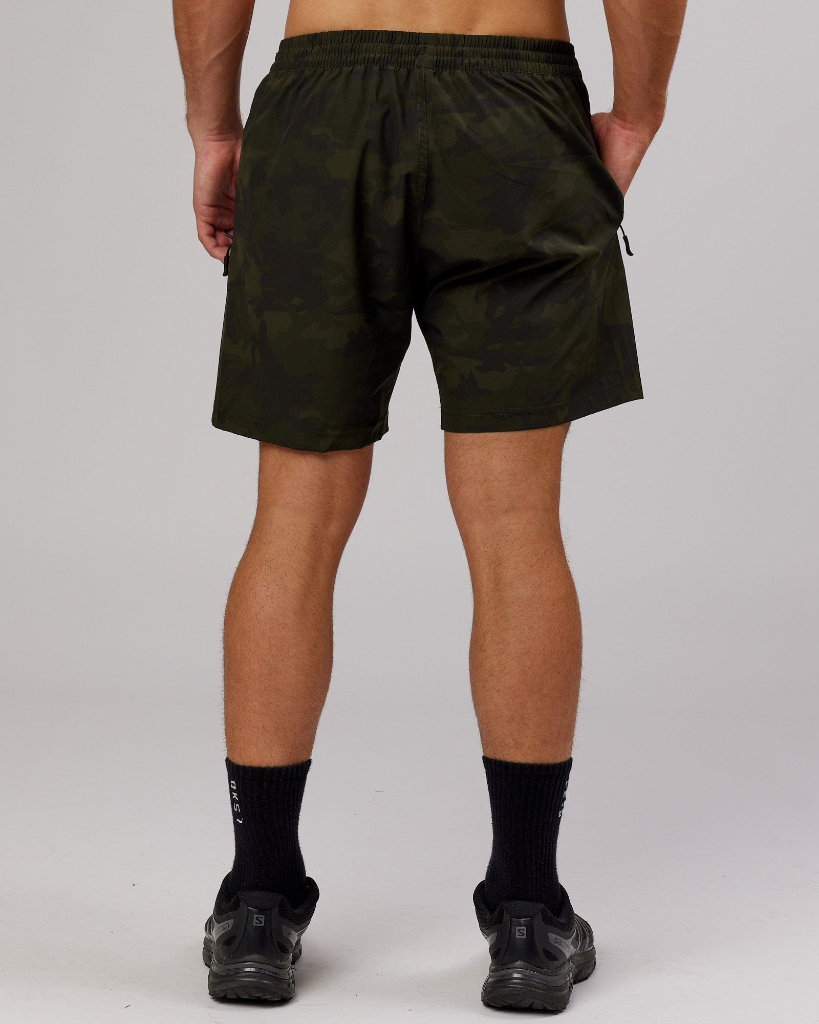 Model wearing Rep 7" Performance Short - Dark Olive Camo